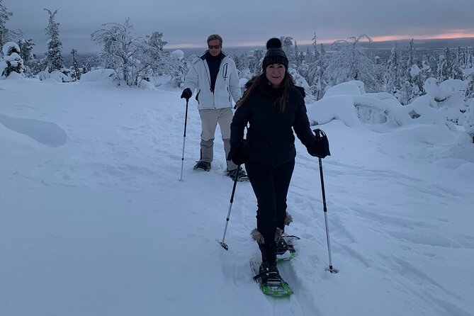 Arctic Reindeer Farm Experience with Snowshoeing in the Wild - Campfire warmth: sausages, pastries, and cozy cabin comfort