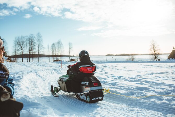Family Snowmobiling in Rovaniemi, Apukka Resort - The sleigh ride for kids, and the adults’ forest route