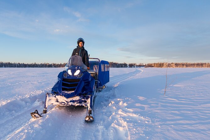 Family Snowmobiling in Rovaniemi, Apukka Resort - After practice, mini-snowmobiles in the safe yard