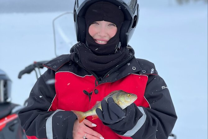 From Saariselkä: Ice Fishing Tour to Lake Inari, reindeers &lunch - Fishing through the ice: what the guide actually does for you