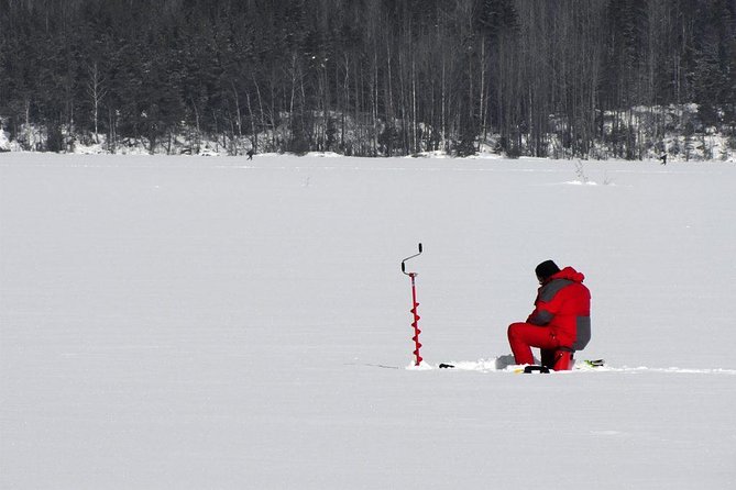 Ice Fishing and Husky - Ice Fishing on the Frozen Lake With a Real Guide
