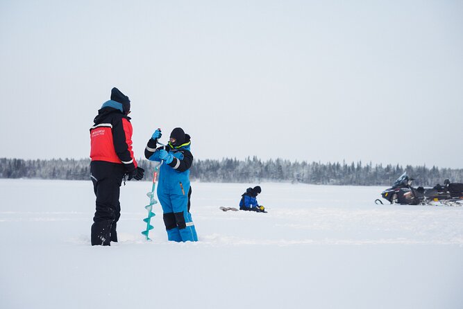 Ice Fishing and Snowmobile Safari Combo in Lapland - The campfire BBQ break: sausages in the wilderness