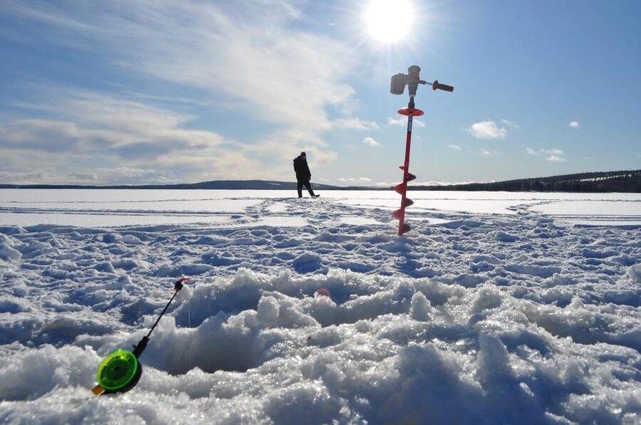 Ice fishing program in Lapland - Drilling Holes and Waiting for a Bite: Your 3-Hour Ice Fishing Session