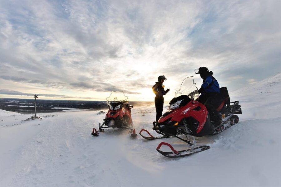 King of Ylläs: Snowmobiling to the Hill - The half-tour break at the top cafe, hot drink, doughnut