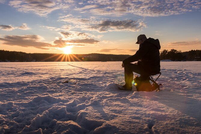 Lapland Ice Fishing Experience from Rovaniemi - Campfire barbecue on snow: warmth, food, and the social reset