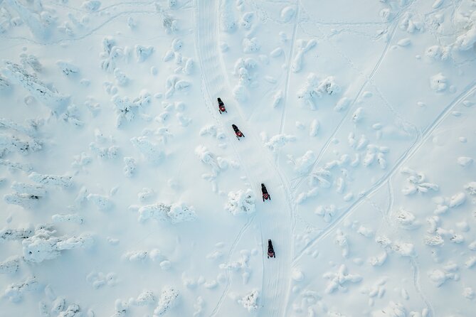 Lappish Lunch Break -Snowmobiling, ice fishing and tasty food - Meeting Safartica in central Rovaniemi, then suiting up fast
