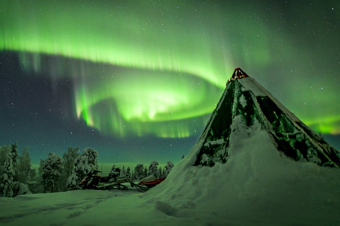 Northern Lights Snowmobile Sleigh Ride - The tepee campfire stop: snacks, warm drinks, and why it keeps the mood right