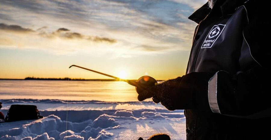 Rovaniemi: Ice Fishing on a Frozen Lake with BBQ and Photos - The lake camp break: hot drinks, snacks, and photo stops