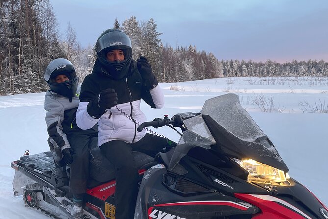 Snowmobile drive experience - The actual ride: snowy forests, frozen lakes, and big open views