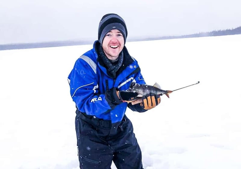 Snowshoe Trip for Ice Fishing in Saariselka - Ice fishing on a frozen lake, from drilling to waiting